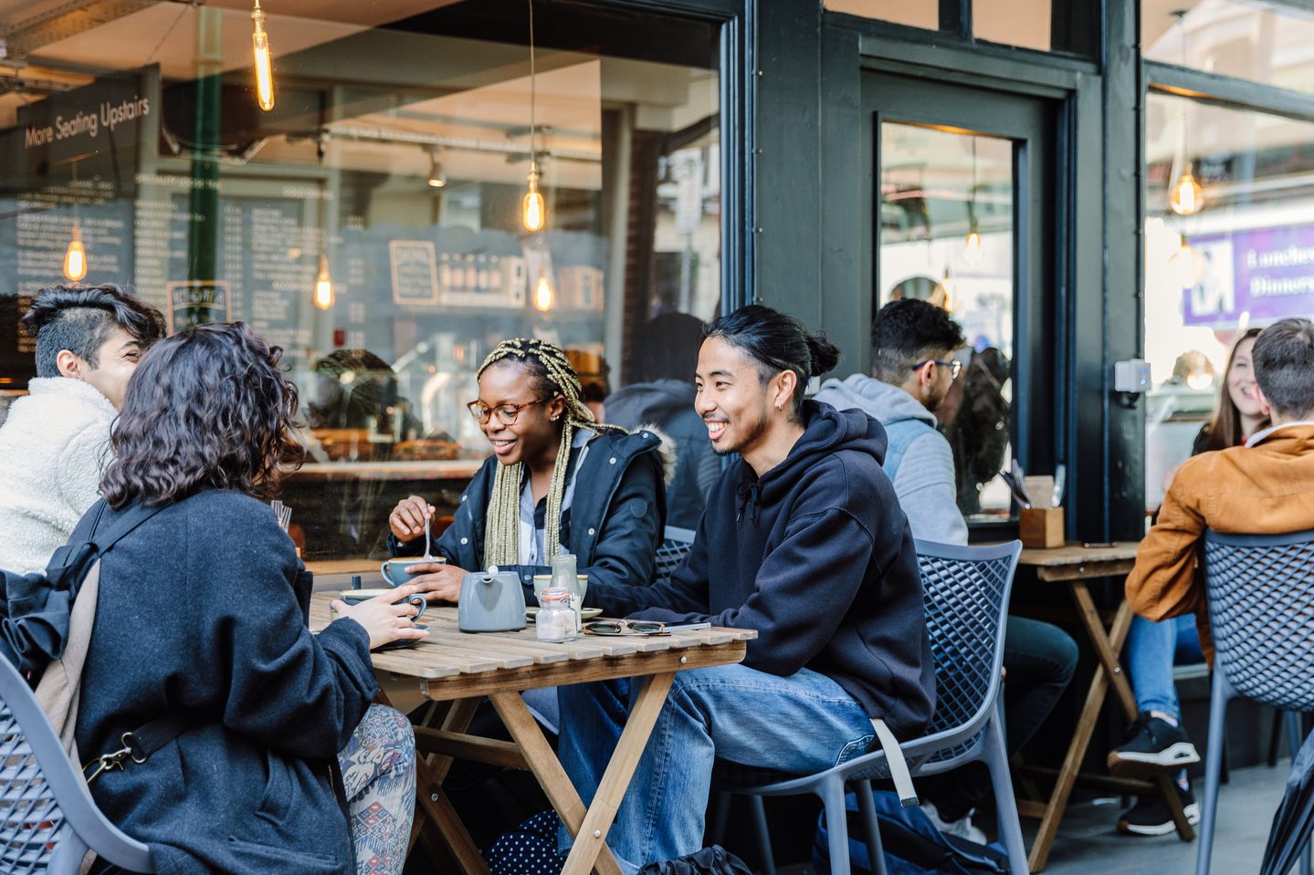Students talking in a coffee shop