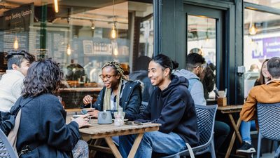 Students talking in a coffee shop