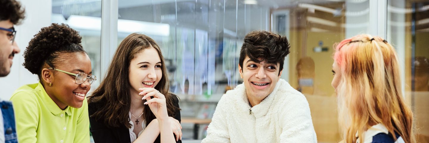 Students talking and studying in a roundtable