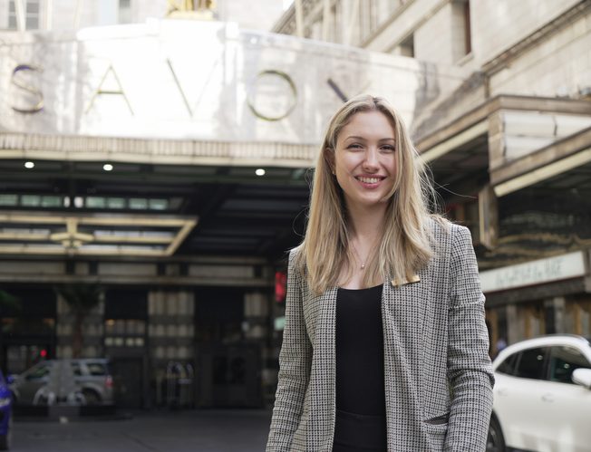 Testimonial from alumni in front of the Savoy London