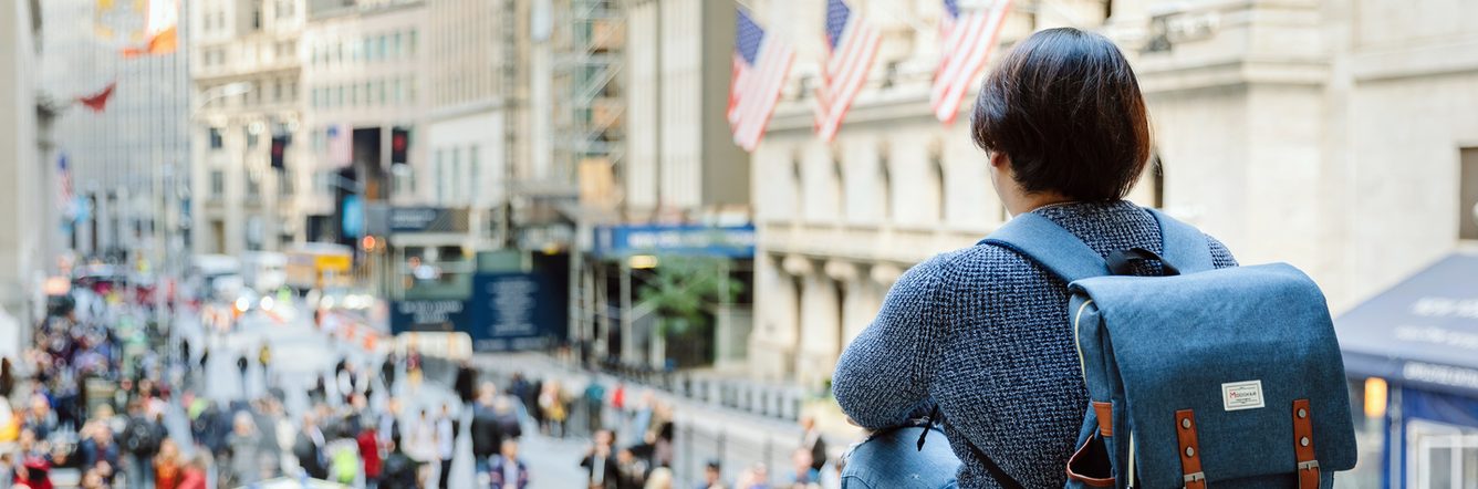 A student overlooking Wall Street in New York
