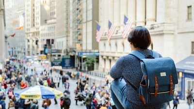 A student overlooking Wall Street in New York