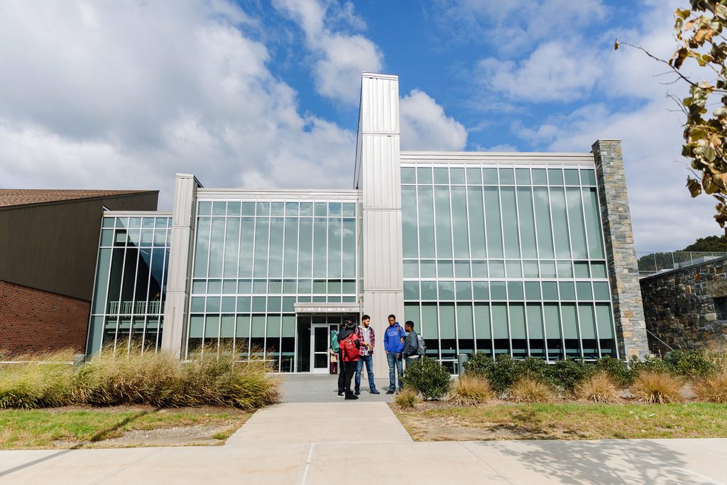 Students in front of a Pace University building in the campus