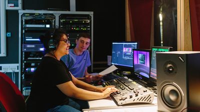 Students in a recording studio using the equipments