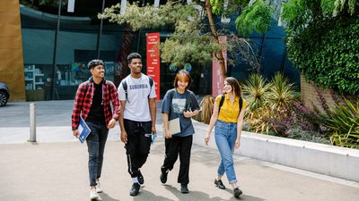 Students walking together inside the university campus