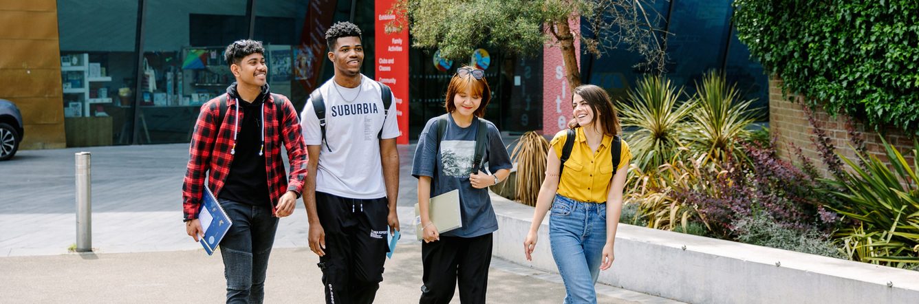 Students walking together inside the university campus