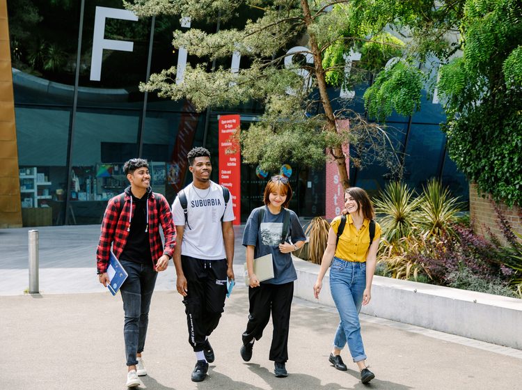 Students walking together inside the university campus
