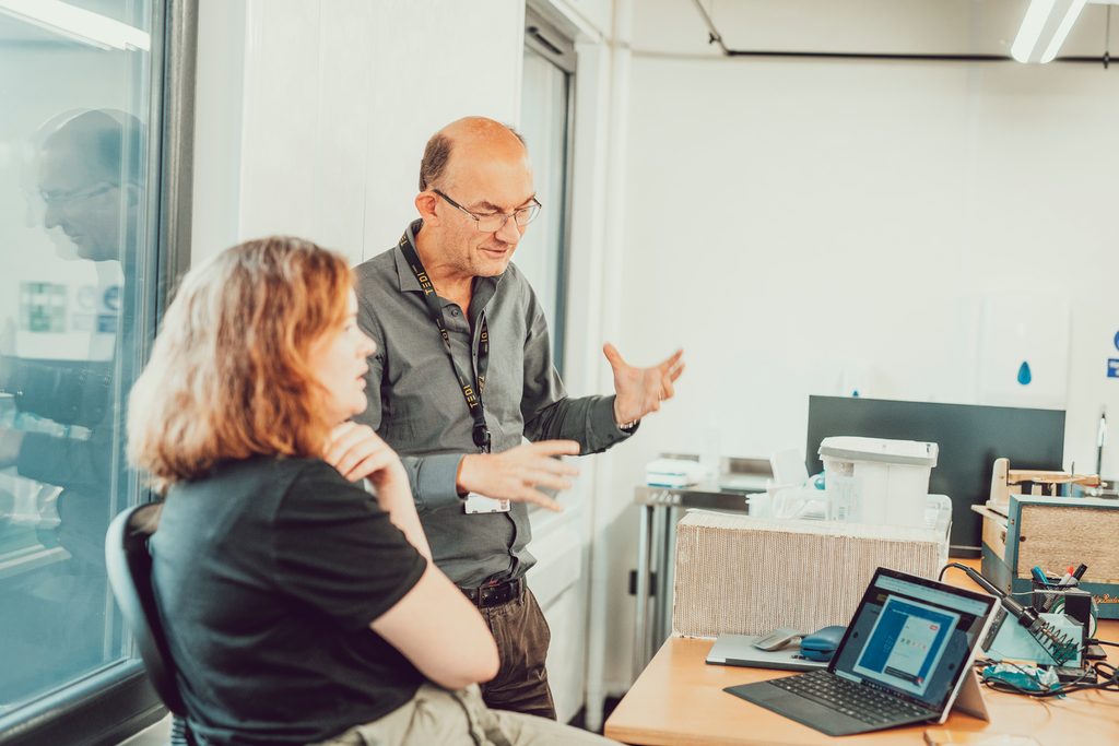 Teachers discussing in classroom