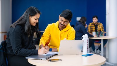 Two UCONN students studying together