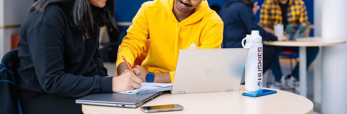 Two UCONN students studying together