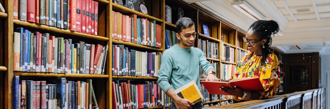 Two University of Westminster students in the library