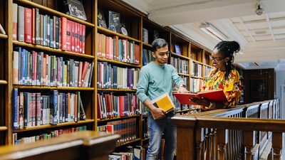 Two University of Westminster students in the library