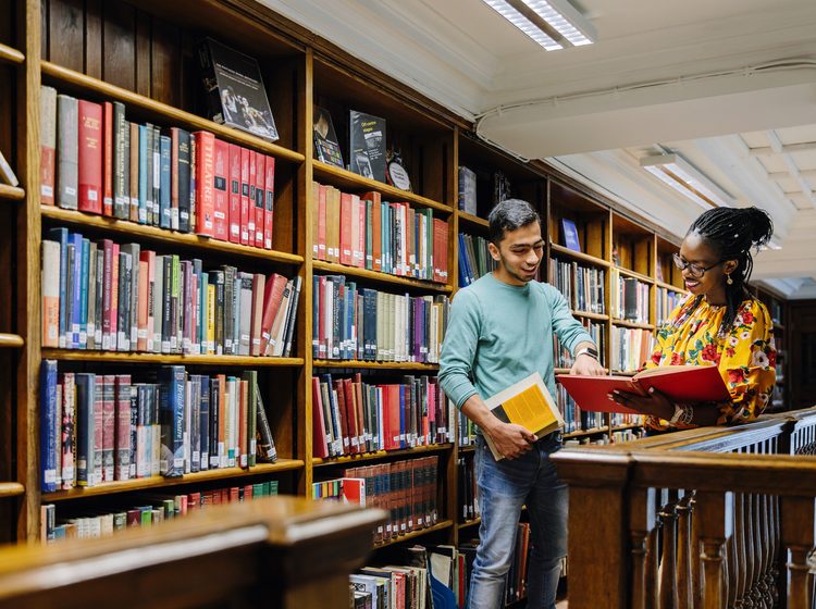 Two University of Westminster students in the library