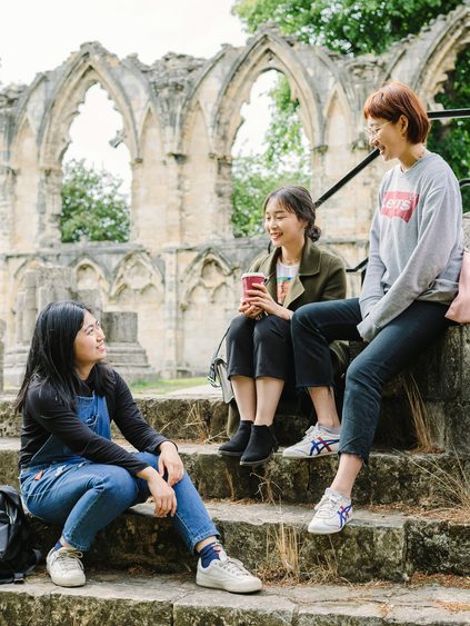 A group of students having a nice time at York Museum Gardens