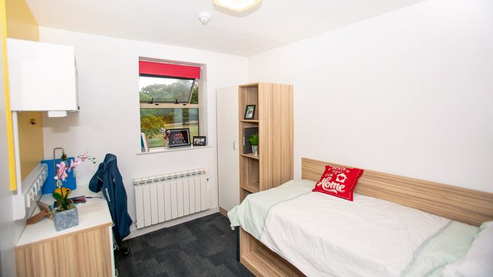 A study desk and a bed at the houses in Essex