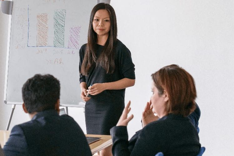 student in classroom with professor