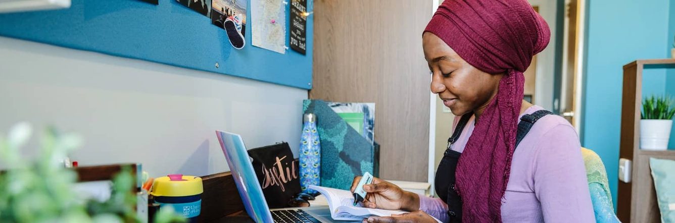 A young woman studies at home