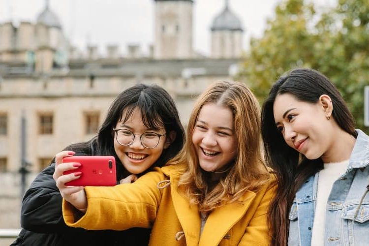 Students taking pictures in London