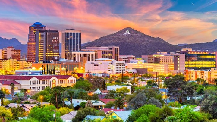 Tucson, Arizona, USA downtown skyline with Sentinel Peak at dusk