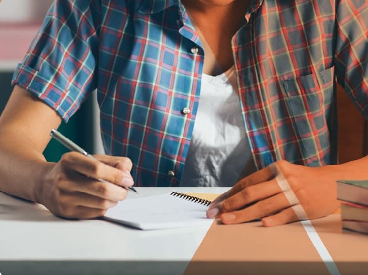 Student sitting on a desk