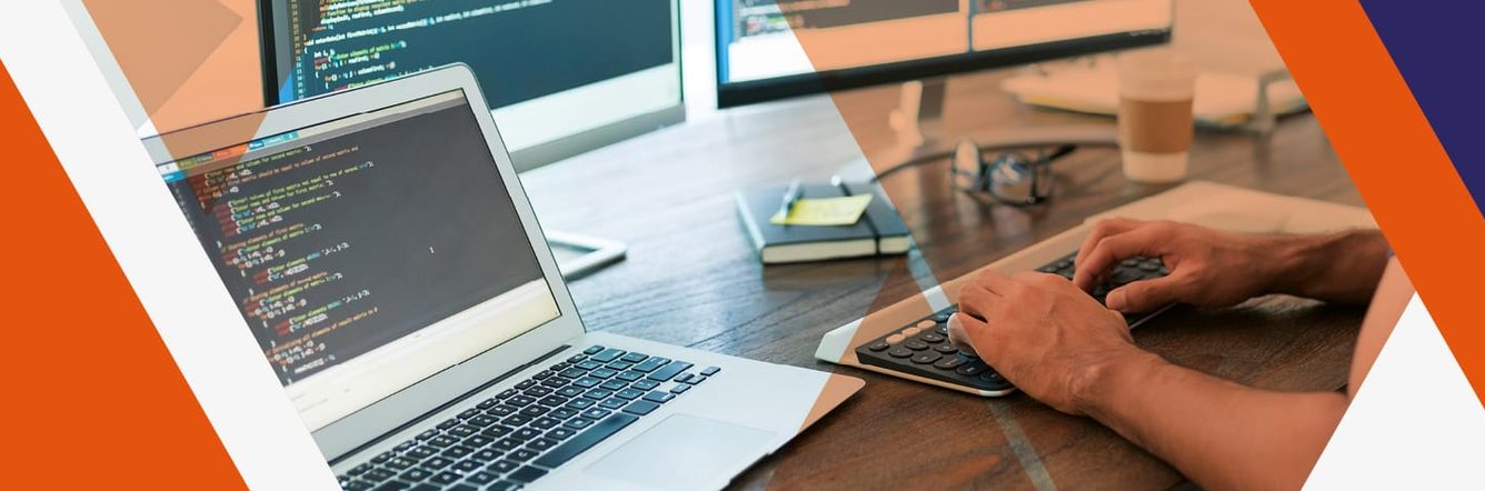 man using several computer screens