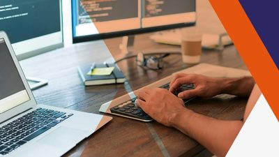 man using several computer screens