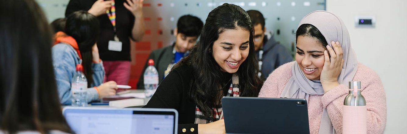 two students on a tablet