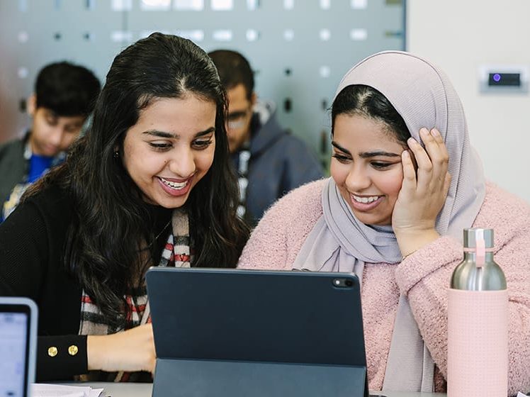 two students on a tablet