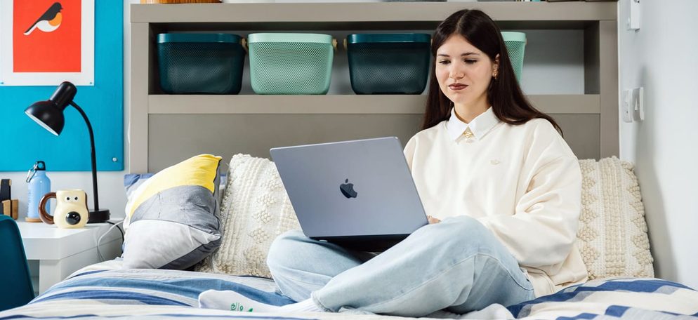 IFP student sitting in bedroom at university of bristol accommodation