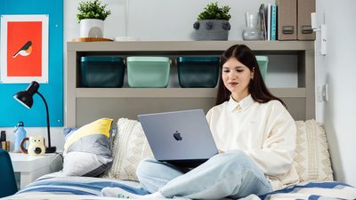 IFP student sitting in classic bedroom at university of bristol accommodation