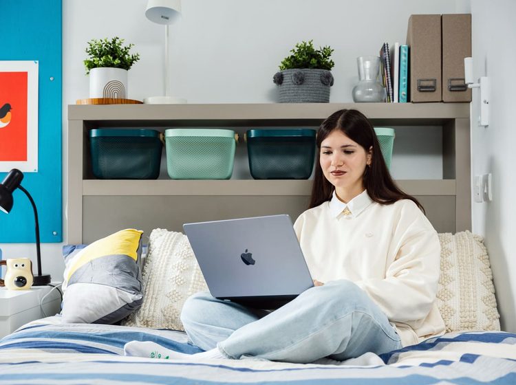 IFP student sitting in classic bedroom at university of bristol accommodation