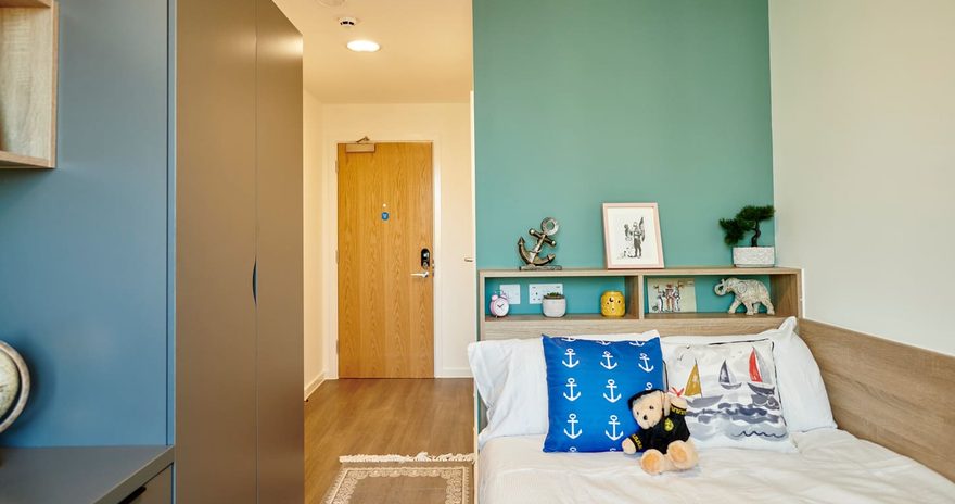 classic ensuite bedroom with a study desk and storage space