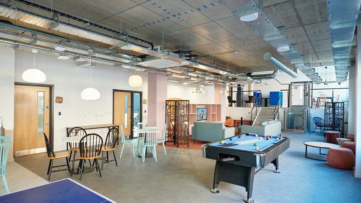 social space including a tv, sofa and games room