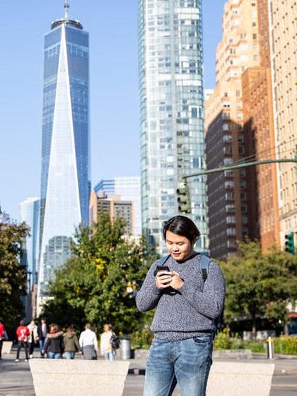 student checking his phone