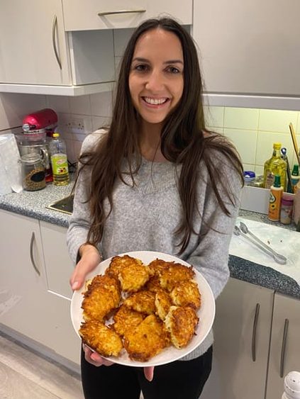 student holding Hanukkah dessert plate