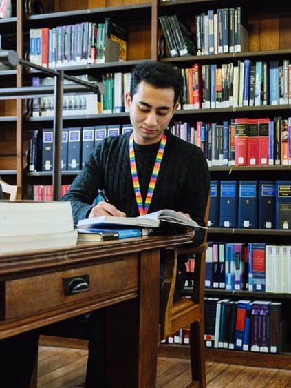 student studying in library