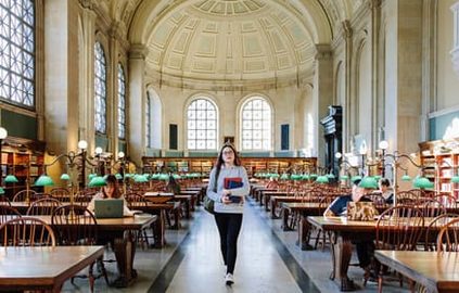 student walking in library