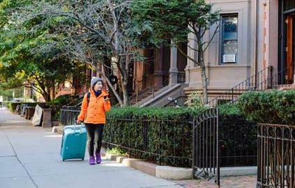 student with luggage