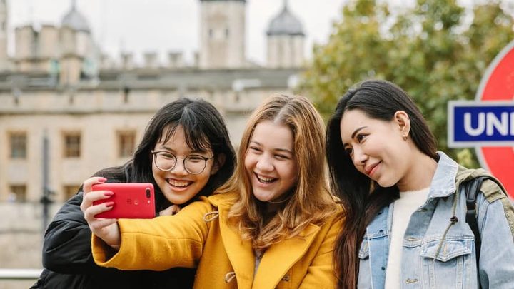 Students taking pictures in London