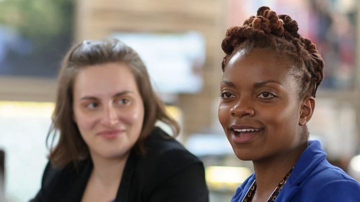 Three women at the Simmons Leadership Conference