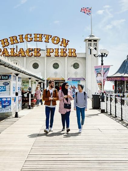 students on brighton pier