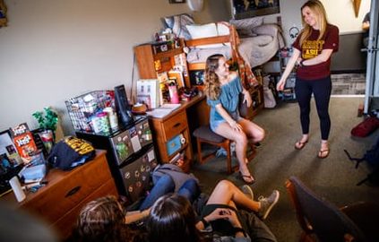 students chatting in their room