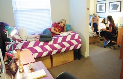 students reading in their room