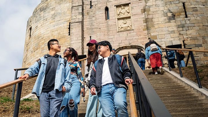 Students walking down the stairs in York