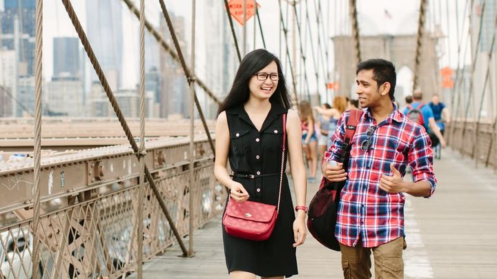 students walking on bridge