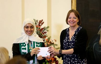 Bashaer receiving an award from the University of Nottingham