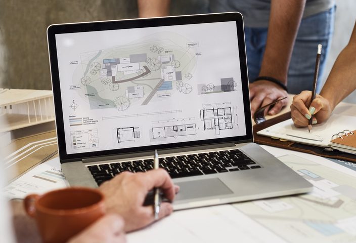 Architecture design blueprint on a laptop