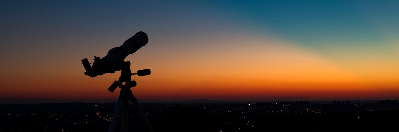 Silhouette of an astronomy telescope