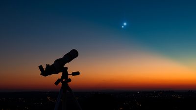 Silhouette of an astronomy telescope