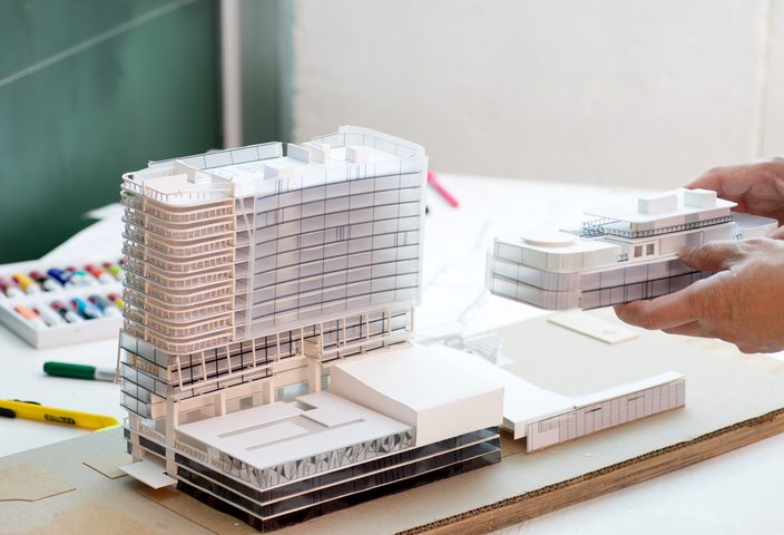 Close up of a building model on a cardboard